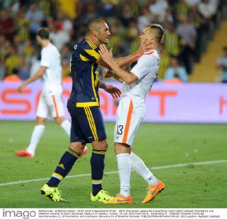 UEFA Champions League third qualifying round match between Fenerbahce and Shakhtar Donetsk at Sukru Saracoglu Stadium in Istanbul, Turkey, 28 July 2015 Final Score : Fenerbahce 0 - Shakhtar Donetsk 0 Pictured: Jose Fernandoa (L) of Fenerbahce and Vyacheslav Shevchuk 13 of Shakhtar Donetsk. 