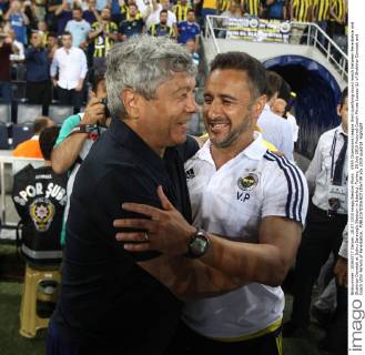 UEFA Champions League third qualifying round match between Fenerbahce and Shakhtar Donetsk at Sukru Saracoglu Stadium in Istanbul, Turkey, 28 July 2015 Pictured:Coach Mircae Lucesu (L) of Shakhtar Donetsk and Coach Vitor Pereira of Fenerbahce.. 