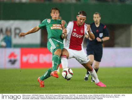 SOCCER - CL quali, Rapid vs Ajax VIENNA,AUSTRIA,29.JUL.15 - SOCCER - UEFA Champions League, qualification, SK Rapid Wien vs AFC Ajax Amsterdam. Image shows Stefan Schwab (Rapid) and Nemanja Gudelj (Ajax). Keywords: Wien Energie. GEPAxpictures xMarioxKneisl