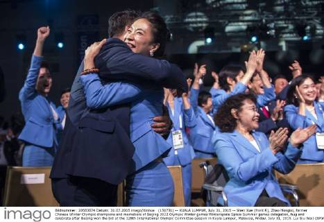 (150731) -- KUALA LUMPUR, July 31, 2015 -- Shen Xue (front R), Zhao Hongbo, former Chinese Winter Olympic champions and memebers of Beijing 2022 Olympic Winter games Winterspiele Spiele Summer games delegation, hug and celebrate after Beijing won the bid at the 128th International Olympic Committee session in Kuala Lumpur, Malaysia, Friday, July 31, 2015. Lui Siu Wai) (SP)MALAYSIA-KUALA LUMPUR-IOC-2022 WINTER OLYMPICS-BEIJING LvxXiaowei 