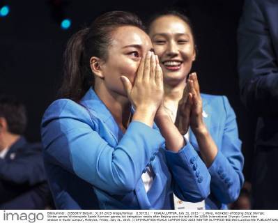(150731) -- KUALA LUMPUR, July 31, 2015 -- Li Nina, memeber of Beijing 2022 Olympic Winter games Winterspiele Spiele Summer games bid delegation reacts after Beijing won the bid at the 128th International Olympic Committee session in Kuala Lumpur, Malaysia, Friday, July 31, 2015. ) (SP)MALAYSIA-KUALA LUMPUR-IOC-2022 WINTER OLYMPICS-BEIJING LuixSiuxWai 