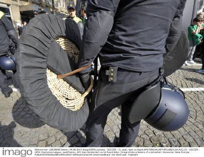 SOCCER - CL quali, Ajax vs Rapid AMSTERDAM,NETHERLANDS,04.AUG.15 - SOCCER - UEFA Champions League, qualification, AFC Ajax Amsterdam vs SK Rapid Wien. Image shows a feature of a policeman. Keywords: Wien Energie. GEPAxpictures xM.xHoermandinger