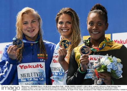 KAZAN, RUSSIA. AUGUST 4, 2015. Silver medalist, Lithuania s Ruta Meilutyte, Gold medalist, Russia s Yuliya Efimova (Yefimova) and Bronze medalist, Jamaica s Alia Atkinson (L-R) at an awards ceremony for the women s 100m Breaststroke final at the 16th FINA World Swimming Championships, at Kazan Arena. Sergei Savostyanov TASS  TS009178