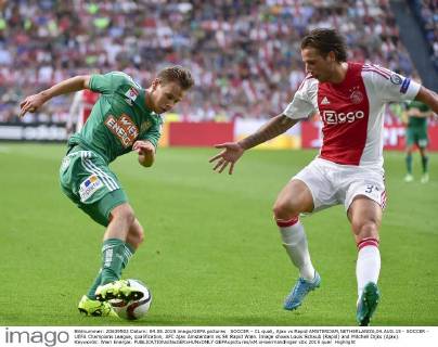 SOCCER - CL quali, Ajax vs Rapid AMSTERDAM,NETHERLANDS,04.AUG.15 - SOCCER - UEFA Champions League, qualification, AFC Ajax Amsterdam vs SK Rapid Wien. Image shows Louis Schaub (Rapid) and Mitchell Dijks (Ajax). Keywords: Wien Energie. GEPAxpictures xM.xHoermandinger