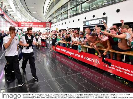 SOCCER - CL quali, Ajax vs Rapid SCHWECHAT,AUSTRIA,04.AUG.15 - SOCCER - UEFA Champions League, qualification, AFC Ajax Amsterdam vs SK Rapid Wien, arrival at the airport Vienna-Schwechat. Image shows Michael Schimpelsberger, Thanos Petsos (Rapid) and fans of Rapid Wien. Keywords: Wien Energie. GEPAxpictures xM.xHoermandinger