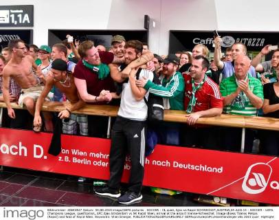 SOCCER - CL quali, Ajax vs Rapid SCHWECHAT,AUSTRIA,04.AUG.15 - SOCCER - UEFA Champions League, qualification, AFC Ajax Amsterdam vs SK Rapid Wien, arrival at the airport Vienna-Schwechat. Image shows Thanos Petsos (Rapid) and fans of Rapid Wien. Keywords: Wien Energie. GEPAxpictures xM.xHoermandinger
