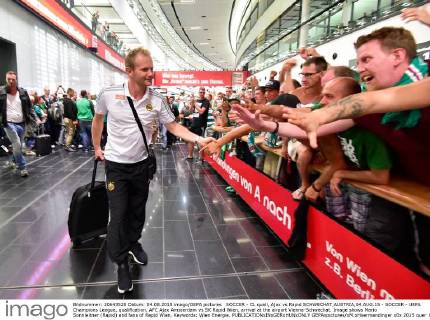 SOCCER - CL quali, Ajax vs Rapid SCHWECHAT,AUSTRIA,04.AUG.15 - SOCCER - UEFA Champions League, qualification, AFC Ajax Amsterdam vs SK Rapid Wien, arrival at the airport Vienna-Schwechat. Image shows Mario Sonnleitner (Rapid) and fans of Rapid Wien. Keywords: Wien Energie. GEPAxpictures xM.xHoermandinger