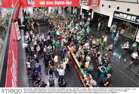 SOCCER - CL quali, Ajax vs Rapid SCHWECHAT,AUSTRIA,04.AUG.15 - SOCCER - UEFA Champions League, qualification, AFC Ajax Amsterdam vs SK Rapid Wien, arrival at the airport Vienna-Schwechat. Image shows fans of Rapid Wien. Keywords: Wien Energie. GEPAxpictures xM.xHoermandinger