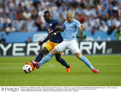 SOCCER - CL quali, Malmoe vs RBS MALMOE,SWEDEN,05.AUG.15 - UEFA Champions League, qualification, Malmoe FF vs Red Bull Salzburg. Image shows Naby Keita (RBS) and Anton Tinnerholm (Malmoe). GEPAxpictures xFelixxRoittner
