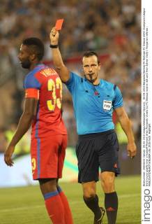 05.08.2015 BeIgrade(Serbia) FK Partizan-FC Steaua UEFA Champions League third round qualify men s football Moment when Fernando Varela (L) FC Steaua receive red card from Istvan Vad(r) Hungarian referee : 