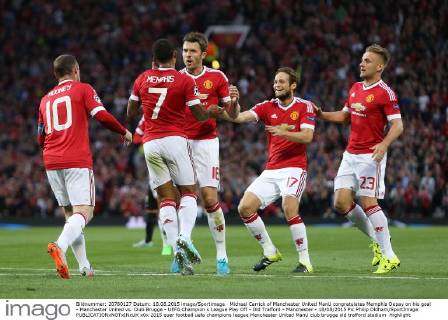 Michael Carrick of Manchester United ManU congratulates Memphis Depay on his goal - Manchester United vs. Club Brugge - UEFA Champion s League Play Off - Old Trafford - Manchester - 18 08 2015 Pic Philip Oldham SportImage EDITORIAL USE ONLY. No use with unauthorised audio, video, data, fixture lists, club league logos or live services. Online in-match use limited to 120 images, no video emulation. No use in betting, games or single club league player publications.