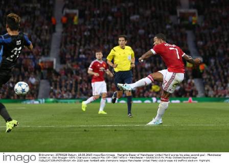 Memphis Depay of Manchester United ManU scores his sides second goal - Manchester United vs. Club Brugge - UEFA Champion s League Play Off - Old Trafford - Manchester - 18 08 2015 Pic Philip Oldham SportImage EDITORIAL USE ONLY. No use with unauthorised audio, video, data, fixture lists, club league logos or live services. Online in-match use limited to 120 images, no video emulation. No use in betting, games or single club league player publications.