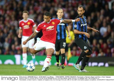 - MANCHESTER, UNITED KINGDOM: Manchester s Memphis Depay and Club s Victor Vazquez Solsona fight for the ball during a soccer game between British club Manchester United ManU FC and Belgian team Club Brugge KV in Manchester, United Kingdom, Tuesday 18 August 2015, the first leg of the play-offs for the UEFA Champions League competition. BRUNOxFAHY  x04682718x