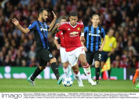 - MANCHESTER, UNITED KINGDOM: Club s Victor Vazquez Solsona and Manchester s Memphis Depay fight for the ball during a soccer game between British club Manchester United ManU FC and Belgian team Club Brugge KV in Manchester, United Kingdom, Tuesday 18 August 2015, the first leg of the play-offs for the UEFA Champions League competition. BRUNOxFAHY x04682719x