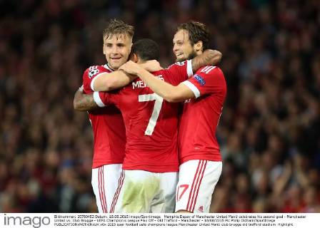 Memphis Depay of Manchester United ManU celebrates his second goal - Manchester United vs. Club Brugge - UEFA Champion s League Play Off - Old Trafford - Manchester - 18 08 2015 Pic Philip Oldham SportImage EDITORIAL USE ONLY. No use with unauthorised audio, video, data, fixture lists, club league logos or live services. Online in-match use limited to 120 images, no video emulation. No use in betting, games or single club league player publications.
