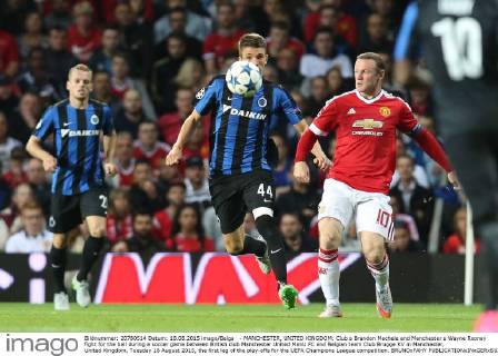 - MANCHESTER, UNITED KINGDOM: Club s Brandon Mechele and Manchester s Wayne Rooney fight for the ball during a soccer game between British club Manchester United ManU FC and Belgian team Club Brugge KV in Manchester, United Kingdom, Tuesday 18 August 2015, the first leg of the play-offs for the UEFA Champions League competition. BRUNOxFAHY x04682734x
