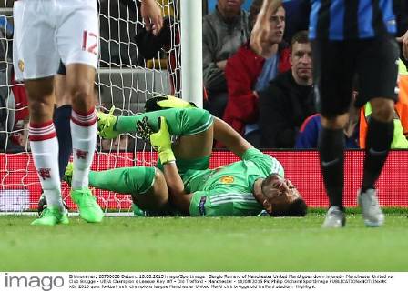 Sergio Romero of Manchester United ManU goes down injured - Manchester United vs. Club Brugge - UEFA Champion s League Play Off - Old Trafford - Manchester - 18 08 2015 Pic Philip Oldham SportImage EDITORIAL USE ONLY. No use with unauthorised audio, video, data, fixture lists, club league logos or live services. Online in-match use limited to 120 images, no video emulation. No use in betting, games or single club league player publications.
