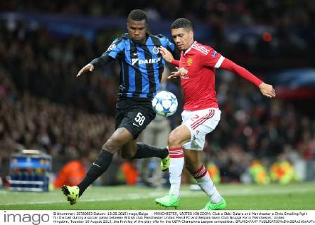 - MANCHESTER, UNITED KINGDOM: Club s Obbi Oulare and Manchester s Chris Smalling fight for the ball during a soccer game between British club Manchester United ManU FC and Belgian team Club Brugge KV in Manchester, United Kingdom, Tuesday 18 August 2015, the first leg of the play-offs for the UEFA Champions League competition. BRUNOxFAHY  x04682752x