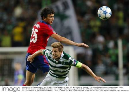 Aug. 18, 2015 - Lisbon, Portugal - CSKA s midfielder Roman Eremenkoheads (L) for the ball with Sporting s midfielder Adrien Silva (R) during the Champions League football play-off first leg match between Sporting CP and PFC CSKA Moscow at Jose Alvalade Stadium in Lisbon on August 18, 2015. NURPHOTO CARLOS PALMA. FBL-EUR-C1-SPORTING-CSKA  - ZUMAn230