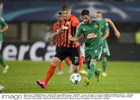 SOCCER - CL play off, Rapid vs Shakhtar VIENNA,AUSTRIA,19.AUG.15 - SOCCER - UEFA Champions League, play off, SK Rapid Wien vs FC Shakhtar Donetsk. Image shows Oleksandr Gladkyy (Shakhtar) and Thanos Petsos (Rapid). Keywords: Wien Energie. GEPAxpictures xPhilippxBrem