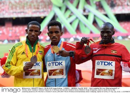 (150822) --BEIJING, Aug 22, 2015 -- Gold medallist Ghirmay Ghebreslassie(C) of Eritrea, silver medallist Yemane Tsegay (L) of Ethiopia and bronze medallist Munyo Solomon Mutai of Uganda, pose for photo during the awarding ceremony for the men s marathon at the 15th IAAF World Athletics Championships 2015 in Beijing, capital of China, on Aug. 22, 2015. ) (CORRECTION)(SP)CHINA-BEIJING-IAAF WORLD CHAMPIONSHIPS-MEN S MARATHON (CN) YuexYuewei 