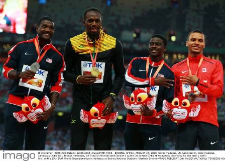 BEIJING, CHINA. AUGUST 24, 2015. Silver medalist, US Justin Gatlin, Gold medalist, Jamaica s Usain Bolt, Bronze medalists, US Trayvon Bromell and Canada s Andre De Grasse (L-R) at an awards ceremony for the men s 100m final at the 15th IAAF World Championships in Athletics at Beijing National Stadium. Vladimir Smirnov TASS  TS00B306