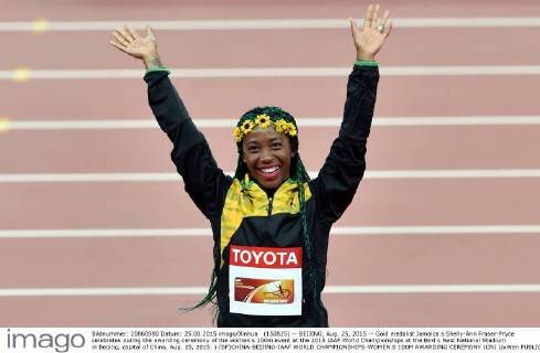 (150825) -- BEIJING, Aug. 25, 2015 -- Gold medalist Jamaica s Shelly-Ann Fraser-Pryce celebrates during the awarding ceremony of the women s 100m event at the 2015 IAAF World Championships at the Bird s Nest National Stadium in Beijing, capital of China, Aug. 25, 2015. ) (SP)CHINA-BEIJING-IAAF WORLD CHAMPIONSHIPS-WOMEN S 100M AWARDING CEREMONY (CN) LixWen 