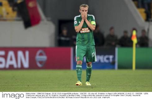 SOCCER - CL play off, Shakhtar vs Rapid LVIV,UKRAINE,25.AUG.15 - SOCCER - UEFA Champions League, play off, FC Shakhtar Donetsk vs SK Rapid Wien. Image shows the disappointment of Christopher Dibon (Rapid). Keywords: Wien Energie. GEPAxpictures xPhilippxBrem