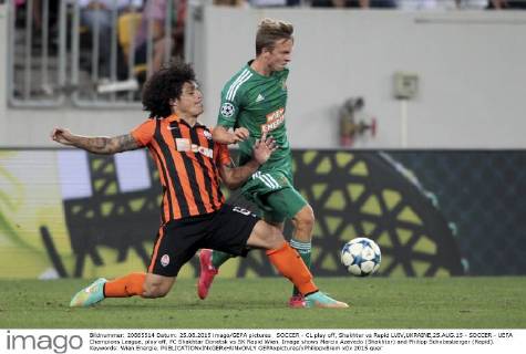 SOCCER - CL play off, Shakhtar vs Rapid LVIV,UKRAINE,25.AUG.15 - SOCCER - UEFA Champions League, play off, FC Shakhtar Donetsk vs SK Rapid Wien. Image shows Marcio Azevedo (Shakhtar) and Philipp Schobesberger (Rapid). Keywords: Wien Energie. GEPAxpictures xPhilippxBrem