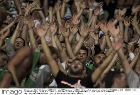 SOCCER - CL play off, Shakhtar vs Rapid LVIV,UKRAINE,25.AUG.15 - SOCCER - UEFA Champions League, play off, FC Shakhtar Donetsk vs SK Rapid Wien. Image shows fans of Rapid. Keywords: Wien Energie. GEPAxpictures xPhilippxBrem