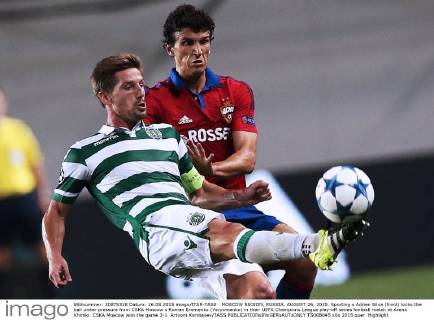 MOSCOW REGION, RUSSIA. AUGUST 26, 2015. Sporting s Adrien Silva (front) kicks the ball under pressure from CSKA Moscow s Roman Eremenko (Yeryomenko) in their UEFA Champions League play-off series football match at Arena Khimki. CSKA Moscow won the game 3-1. Artyom Korotayev TASS  TS00B845