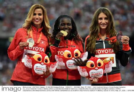 (150827) -- BEIJING, Aug. 27, 2015 -- Gold medalist Kenya s Hyvin Kiyeng Jepkemoi (C), silver medalist Tunisia s Habiba Ghribi (L) and bronze medalist Germany s Gesa Felicitas Krause celebrate during the women s 3000m steeplechase awarding ceremony at the IAAF World Championships at the Bird s Nest Naitonal Stadium in Beijing, capital of China, Aug. 27, 2015. ) (SP)CHINA-BEIJING-IAAF WORLD CHAMPIONSHIPS-WOMEN S 3000M STEEPLECHASE AWARDING CEREMONY (CN) LixWen 