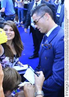 Aug. 27, 2015 - Monaco, Monaco - Real Madrid forward CRISTIANO RONALDO autographing for fans while walking in the Forum Grimaldi Blue Carpet to attend the best Europe soccer player election 2015. Soccer 2015 - UEFA Champions League 2015 - 16 Draws  - ZUMAm119