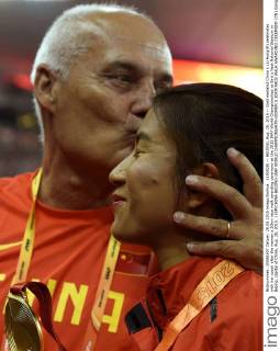 (150828) -- BEIJING, Aug. 28, 2015 -- Gold medalist China s Liu Hong(R) celebrates with her coach after the women s 20km race walk awarding ceremony at the 2015 IAAF World Championships at Bird s Nest National Stadium in Bejing, capital of China, Aug. 28, 2015. ) (SP)CHINA-BEIJING-IAAF WORLD CHAMPIONSHIPS-WOMEN S 20KM RACE WALK AWARDING CEREMONY (CN) GongxLei 