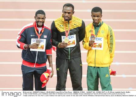 BEIJING, CHINA - AUGUST 28: (CHINA OUT) (L-R) Silver medalist Justin Gatlin of the United States, gold medalist Usain Bolt of Jamaica and bronze medalist Anaso Jobodwana of South Africa pose on the podium during the medal ceremony for the Men s 200 metres final during day seven of the 15th IAAF World Athletics Championships Beijing 2015 at Beijing National Stadium on August 28, 2015 in Beijing, China.  CFP471986691 