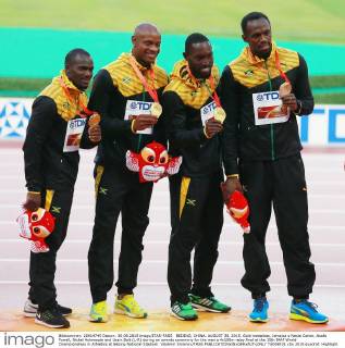 BEIJING, CHINA. AUGUST 30, 2015. Gold medalists, Jamaica s Nesta Carter, Asafa Powell, Nickel Ashmeade and Usain Bolt (L-R) during an awards ceremony for the men s 4x100m relay final at the 15th IAAF World Championships in Athletics at Beijing National Stadium. Vladimir Smirnov TASS  TS00BF31