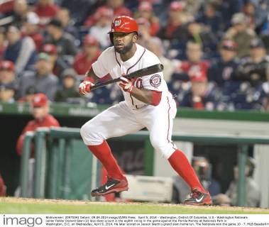 April 9, 2014 - Washington, District Of Columbia, U.S - Washington Nationals center fielder Denard Span (2) lays down a bunt in the eighth inning in the game against the Florida Marlins at Nationals Park in Washington, D.C. on Wednesday, April 9, 2014. He later scored on Jayson Werth s grand slam home run. The Nationals won the game 10 - 7. MLB Baseball Herren USA 2014 - Marlins Beat Nationals 7-1 - ZUMAp124