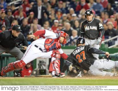 April 9, 2014 - Washington, District Of Columbia, U.S - Miami Marlins right fielder Giancarlo Stanton (27) is tagged out by Washington Nationals catcher Jose Lobaton (59) in the eighth inning of the game at Nationals Park in Washington, D.C. on Wednesday, April 9, 2014. The Nationals won the game 10 - 7. MLB Baseball Herren USA 2014 - Marlins Beat Nationals 7-1 - ZUMAp124