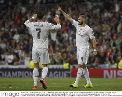 Soccer match between Real Madrid and Shakhtar Donetsk of the 2015 2016 Champions League, held at the Santiago Bernabeu stadium, in Madrid 09 15 2015. Karim Benzema celebrates after scoring with Cristiano Ronaldo 