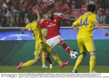Sept. 15, 2015 - Lisbon, Portugal - Benfica s forward Kostas Mitroglou (C) vies for the ball with Astana s midfielder Georgiy Zhukov (L) during the Champions League football match between SL Benfica and Astana at Luz Stadium in Lisbon on September 15, 2015. NURPHOTO CARLOS PALMA. FBL-EUR-C1-SPORTING-ASTANA  - ZUMAn230
