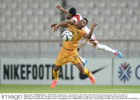 Hamid Osman (R) of Syria s Al Jaish SC vies with Fuakuputu Doris of Kuwait s Al Qadsia SC during their AFC CUP 2015 quarter-final match in Kuwait City, Kuwait, on Sept. 15, 2015. Qadsia SC lost 0-2 and advanced to the semi-finals of the 2015 AFC Cup 2015 with a 3-2 aggregate win. ) (SP)KUWAIT-KUWAIT CITY-AFC CUP 2015- AL JAISH SC VS AL QADSIA SC NoufalxIbrahim 