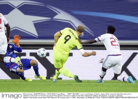 - GENT, BELGIUM: Lyon s goalkeeper Anthony Lopes, Gent s Laurent Depoitre and Lyon s Samuel Umtiti fight for the ball during the first game in the group stage of the Uefa Champions League competition, in group H, between Belgian first league soccer team KAA Gent and Olympique Lyon, in Gent, Wednesday 16 September 2015. YORICKxJANSENS  x04701460x