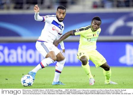- GENT, BELGIUM: Lyon s Alexandre Lacazette and Gent s Moses Simon fight for the ball during the first game in the group stage of the Uefa Champions League competition, in group H, between Belgian first league soccer team KAA Gent and Olympique Lyon, in Gent, Wednesday 16 September 2015. YORICKxJANSENS x04701469x