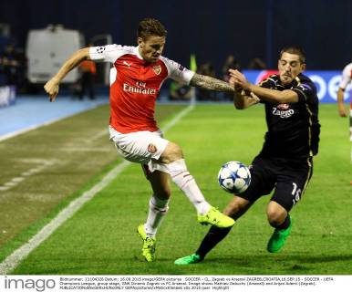 SOCCER - CL, Zagreb vs Arsenal ZAGREB,CROATIA,16.SEP.15 - SOCCER - UEFA Champions League, group stage, GNK Dinamo Zagreb vs FC Arsenal. Image shows Mathieu Debuchy (Arsenal) and Arijan Ademi (Zagreb). GEPAxpictures xMaticxKlansek
