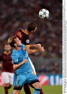 16.09.2015. Rome, Italy. Champions League. Roma versus Barcelona. Ivan Rakitic and Edin Dzeko fight for the header xGiuseppexMaffiax  ActionPlus11660848