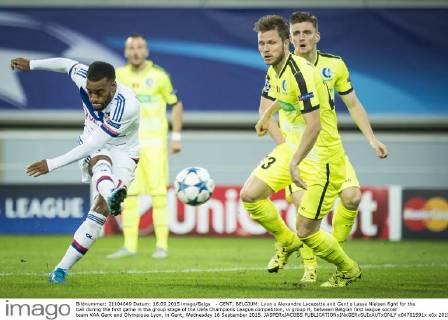 - GENT, BELGIUM: Lyon s Alexandre Lacazette and Gent s Lasse Nielsen fight for the ball during the first game in the group stage of the Uefa Champions League competition, in group H, between Belgian first league soccer team KAA Gent and Olympique Lyon, in Gent, Wednesday 16 September 2015. JASPERxJACOBS x04701591x