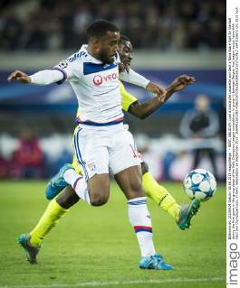 - GENT, BELGIUM: Lyon s Alexandre Lacazette and Gent s Nana Asare fight for the ball during the first game in the group stage of the Uefa Champions League competition, in group H, between Belgian first league soccer team KAA Gent and Olympique Lyon, in Gent, Wednesday 16 September 2015. JASPERxJACOBS x04701667x