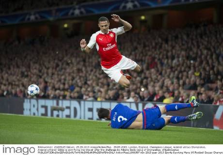 29.09.2015. London, England. Champions League. Arsenal versus Olympiakos. Arsenal s Kieran Gibbs is sent flying into the air after the challenge by Alberto Bot& xed;a of Olympiakos. xNigelxCookex  ActionPlus11666307