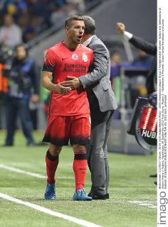 UEFA Champions League Group C football match between Astana and Galatasaray at Astana Arena in Astana, Kazakhstan, 30 September 2015 Final Score: Astana 2 - Galatasaray 2 Pictured: Coach Hamza Hamzaoglu and Lukas Podolski of Galatasaray 