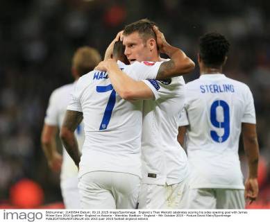 England s Theo Walcott celebrates scoring his sides opening goal with James Milner Euro 2016 Qualifier- England vs Estonia - Wembley Stadium - England - 9th October 2015 - Picture David Klein Sportimage EDITORIAL USE ONLY. No use with unauthorised audio, video, data, fixture lists, club league logos or live services. Online in-match use limited to 120 images, no video emulation. No use in betting, games or single club league player publications.